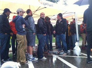 Team directors wait in vain for the rain to stop at the Nature Valley GP