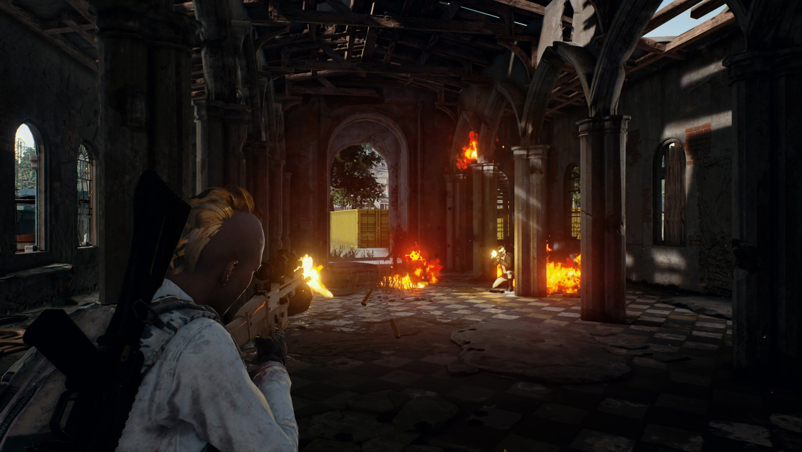 Shooting up enemies in a long hallway in PlayerUnknown's Battlegrounds