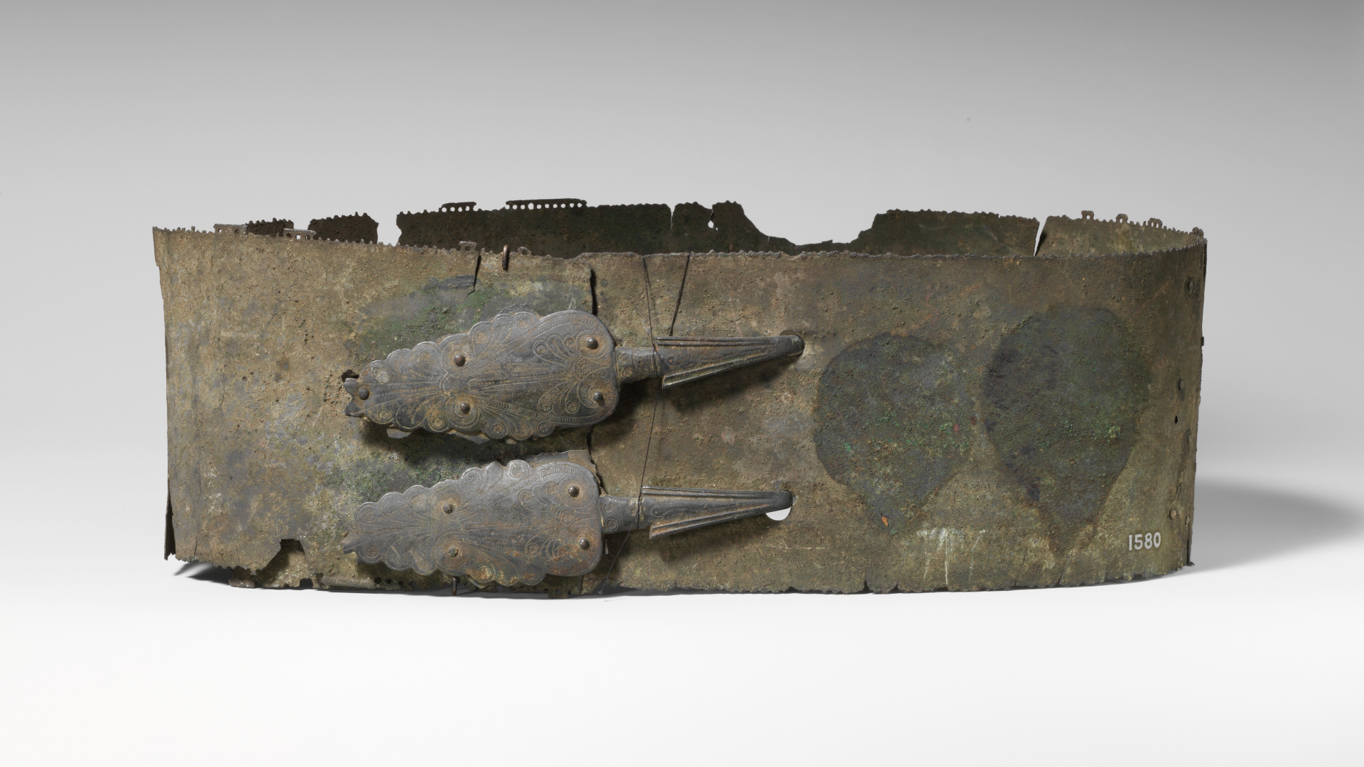 a bronze belt with leaf-shaped mounts