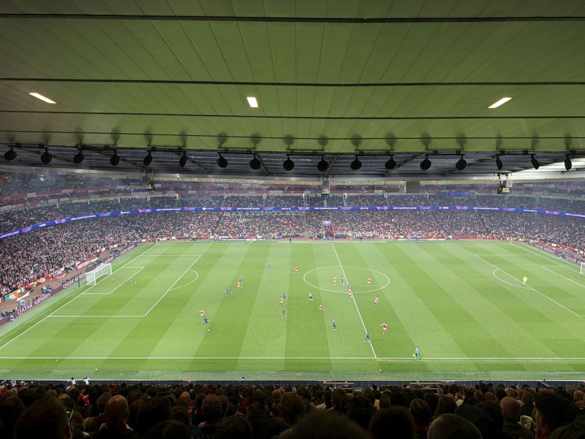 A Champions League soccer match between Arsenal and Atletico Madrid, as seen from the upper stand at the Emirates stadium, London. Zoomed in photos of the players