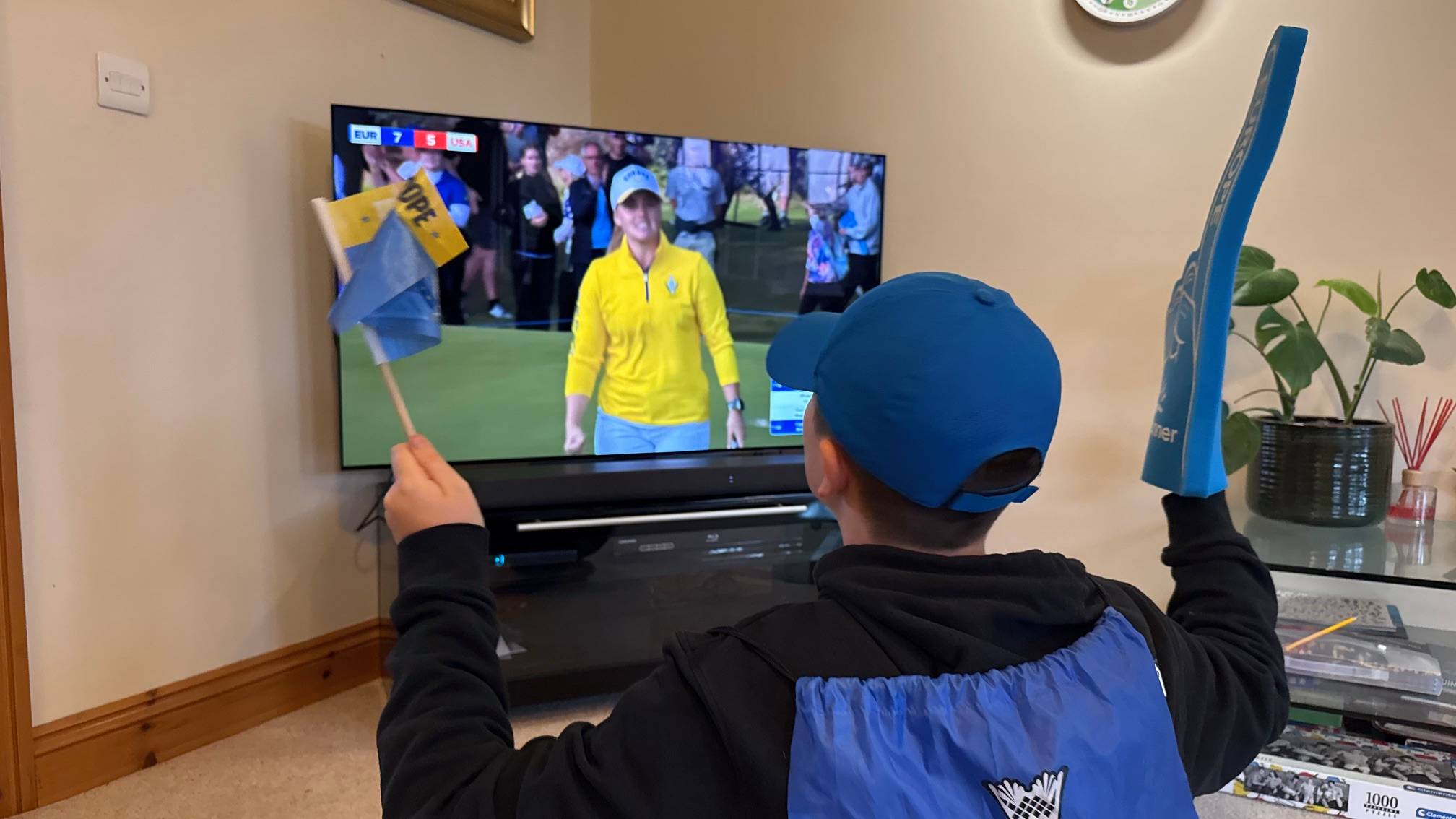 Junior golfer watching the Solheim Cup