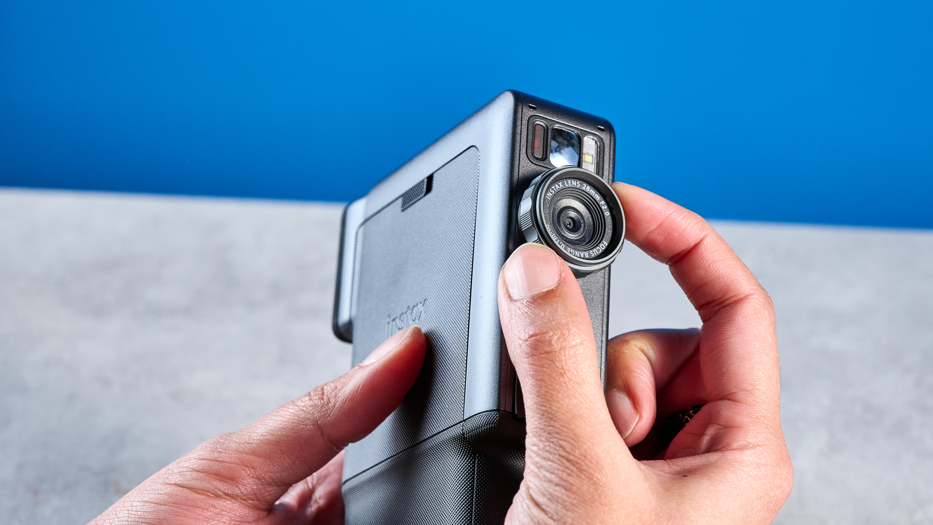 A Fujifilm Instax mini Evo Cinema hybrid instant camera