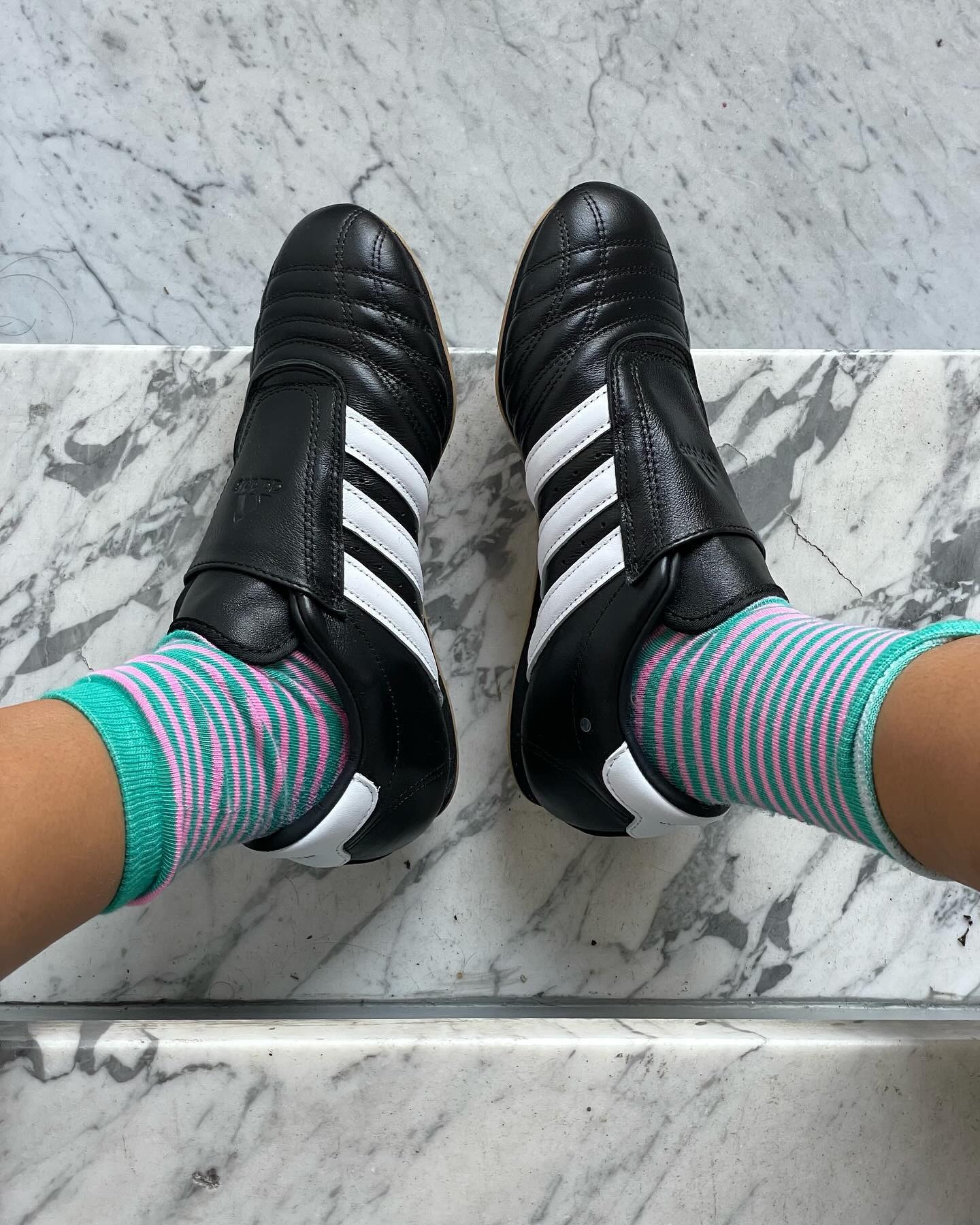 Influencer Michelle Li wears Adidas sneakers.