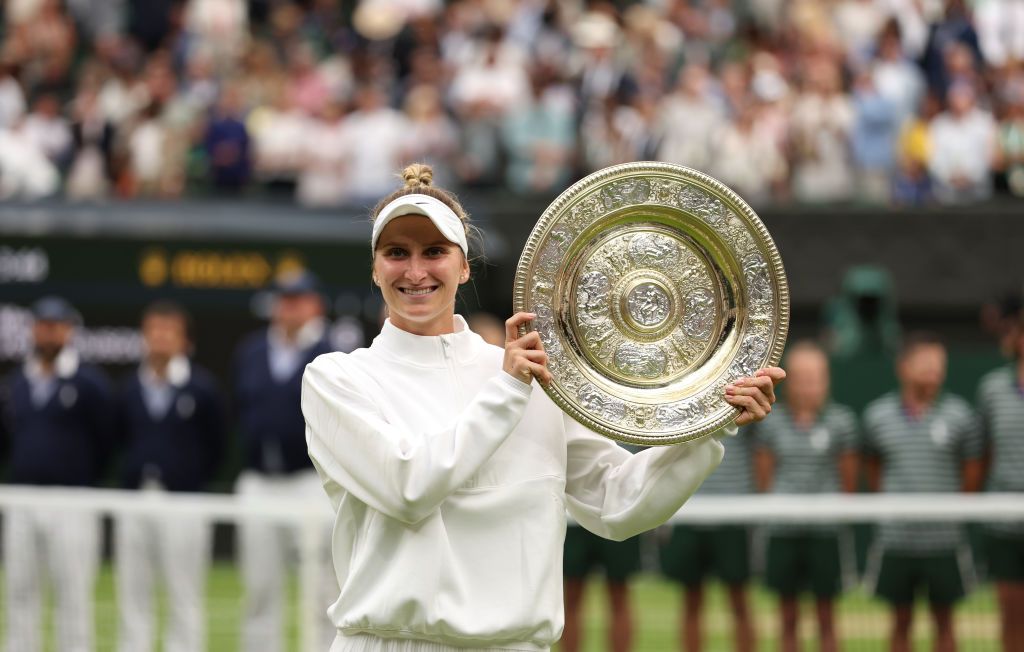 Marketa Vondrousova holds the trophy following her single&amp;#039;s victory at Wimbledon