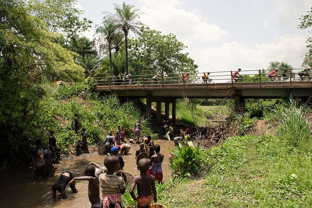 An insight into the realities of rural life in Sierra Leone. People fish as the race flashes by.