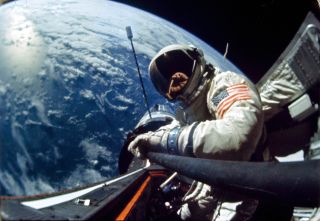 Buzz Aldrin, Gemini 12 pilot, performs a standup EVA (extravehicular activity) during the first day of the 4-day mission in space.