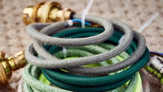 a pile of colourful electrical light cables on a beige carpet