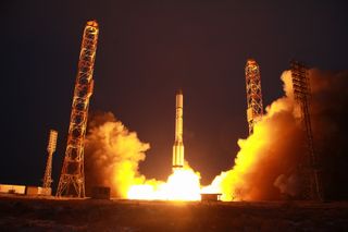 A Russian Proton rocket carrying the Express-AMU3 and Express-AMU7 communications satellites lifts off from a pad at Baikonur Cosmodrome, Kazakhstan on Dec. 13, 2021.