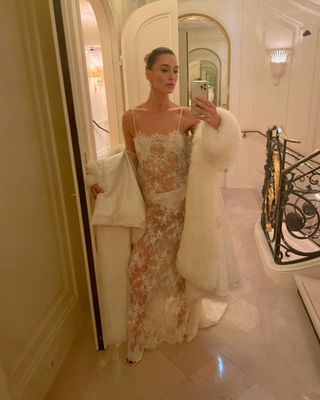 @camillecharriere wearing a lace wedding dress