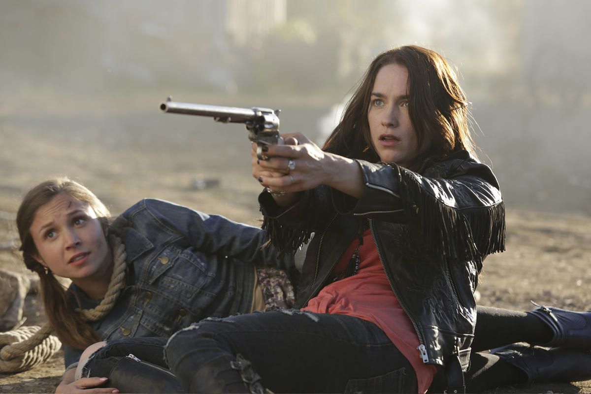 Wynonna Earp holds a gun on Syfy.