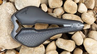 A top-view of the Velo Angel TT saddle, showing its arrow-shaped cut-out, padded flanks and short nose