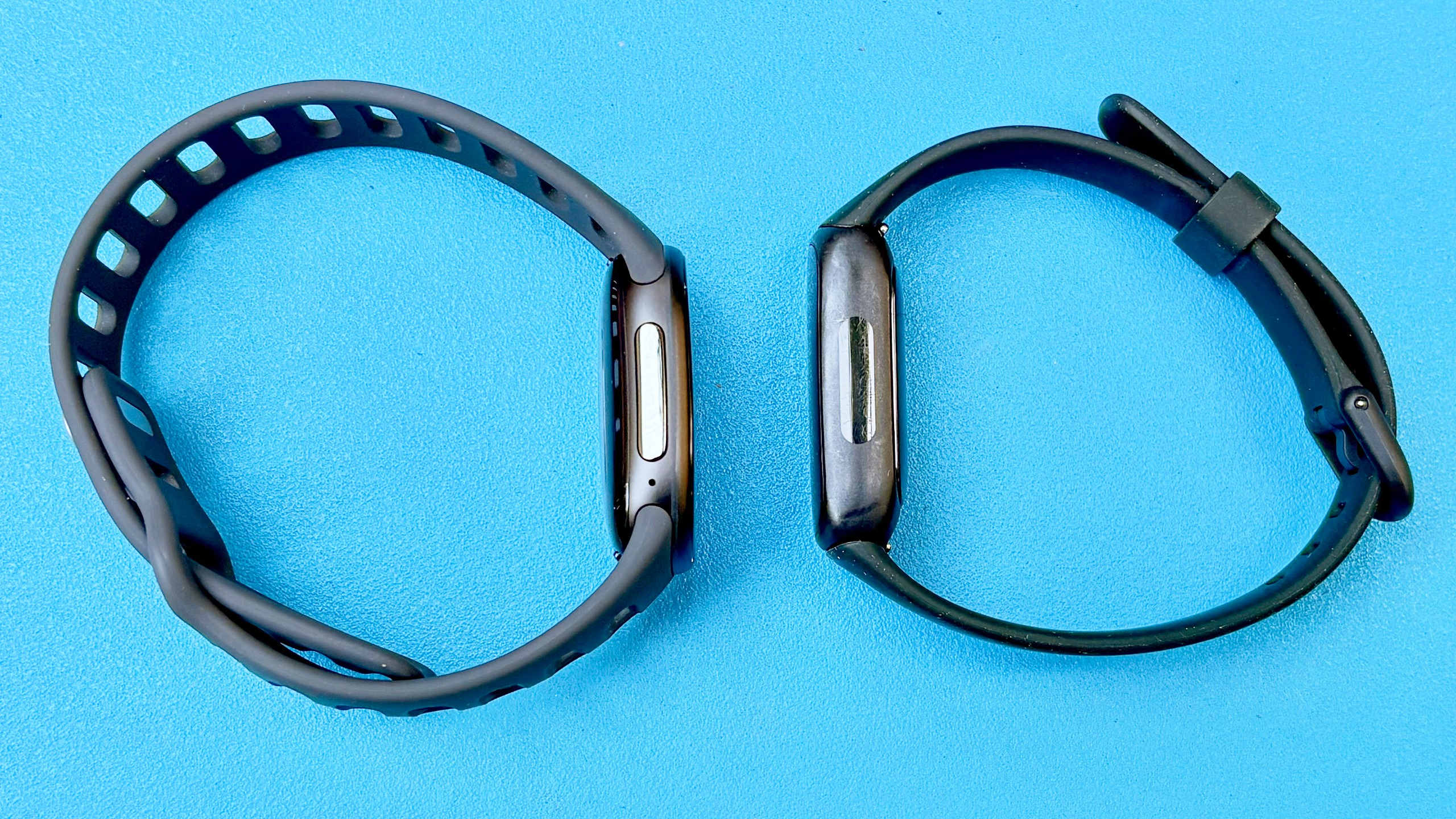 Close-up of the Fitbit Edge next to the Fitbit Inspire 3