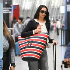 Dua Lipa traveling in a summer airport outfit