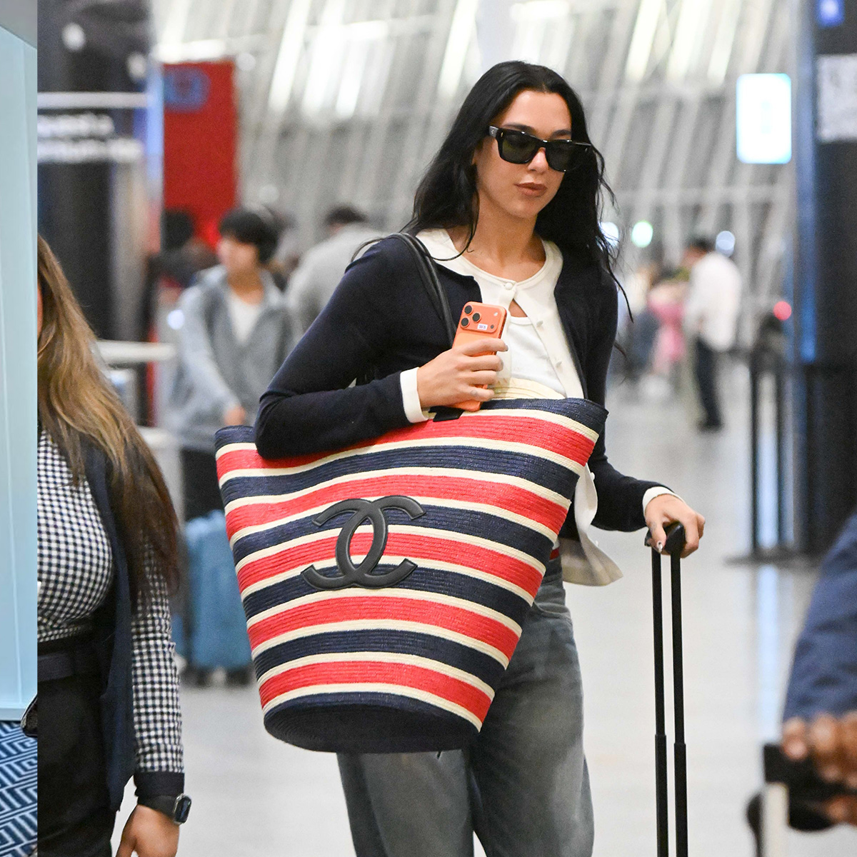 Dua Lipa traveling in a summer airport outfit