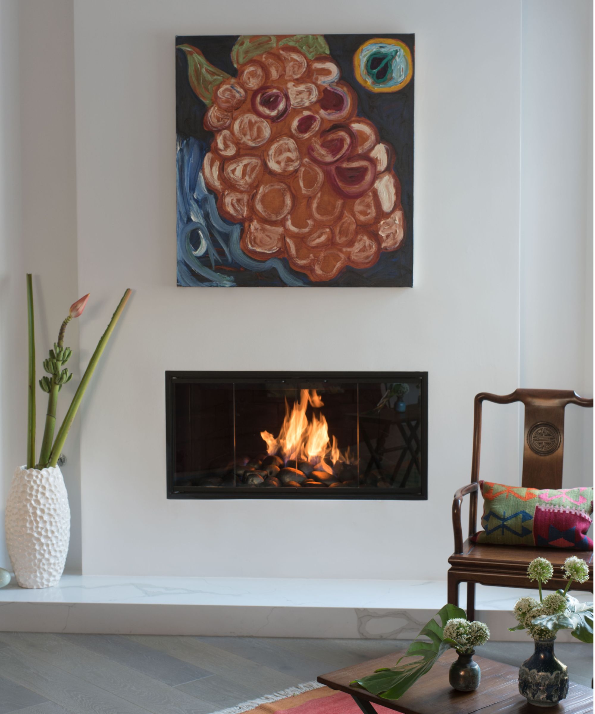 Art above a modern fireplace