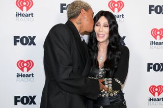 Alexander Edwards and Cher pose in the press room during the 2024 iHeartRadio Music Awards at Dolby Theatre on April 01, 2024 in Hollywood, California.