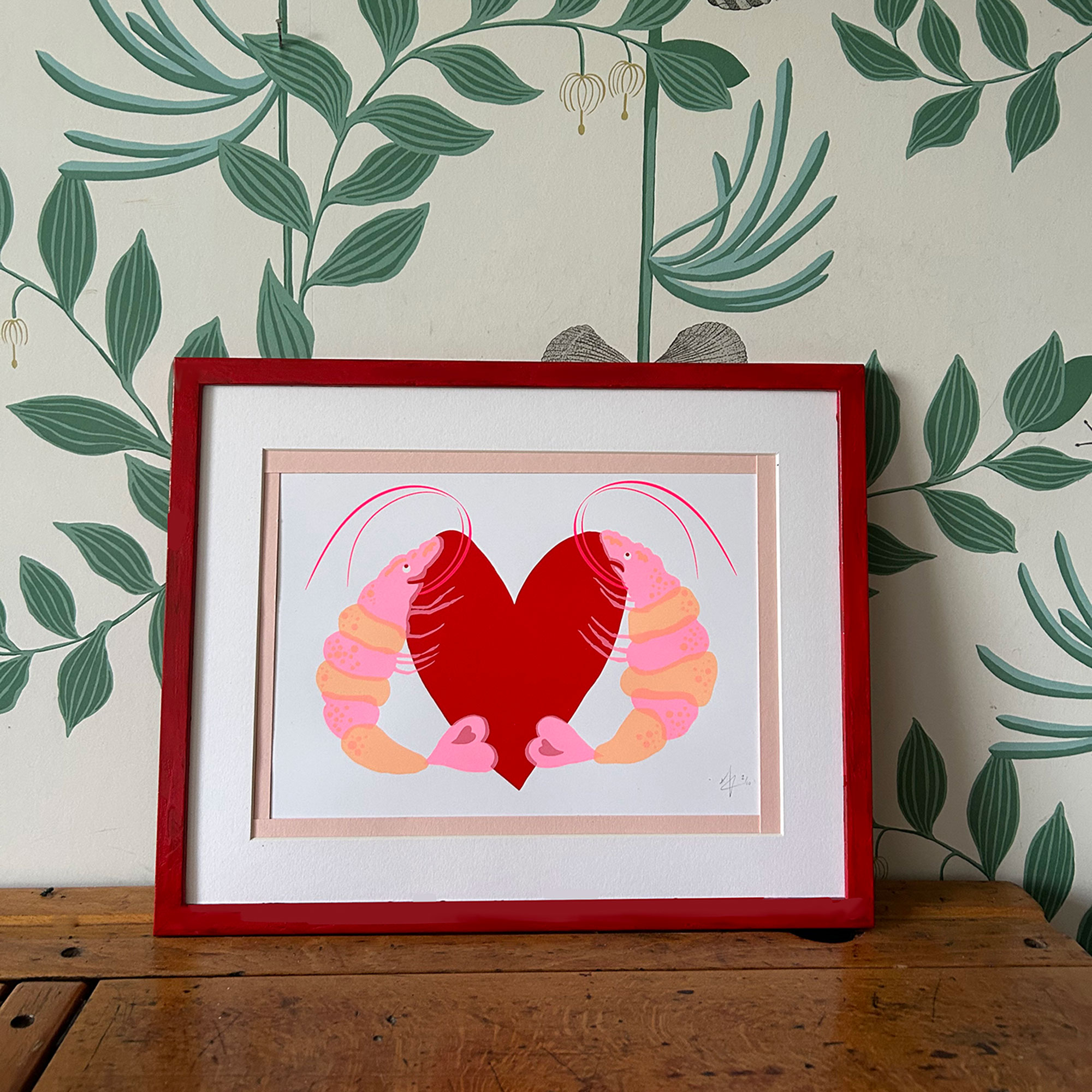 Artwork of two prawns holding a red heart