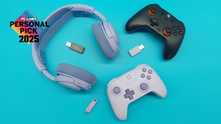 Various bits of purple PC gear--a set of gaming headphones, two controllers with 2.4 Ghz dongles, and a teeny-tiny USB--on a blue background. The 'PC Gamer Personal Pick 2025' badge floats in the top-left corner.