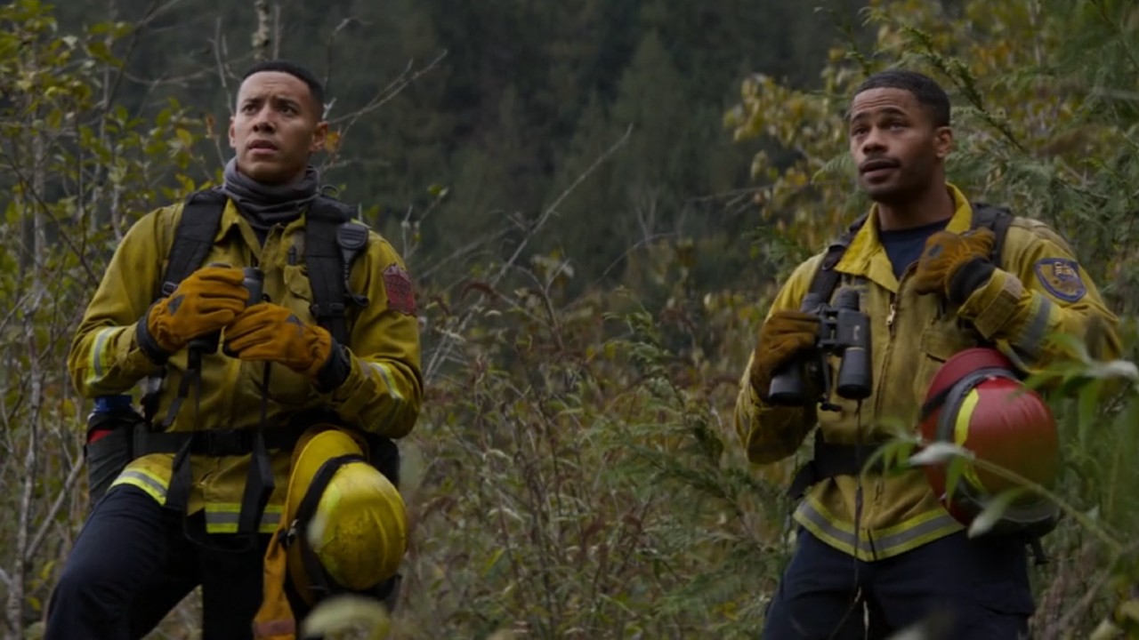 Malcolm and Jake looking at the fire in the Fire Country mid-season finale.