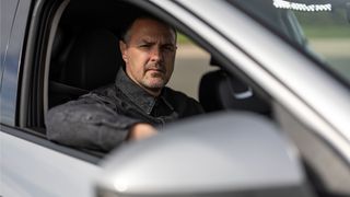 Paddy McGuinness behind the wheel of a car for Top Gear season 33