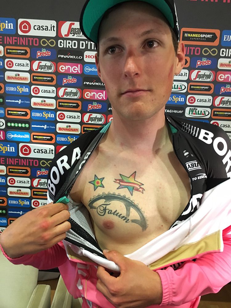 Lukas P&ouml;stlberger (Bora-hansgrohe) shows off his tattoo