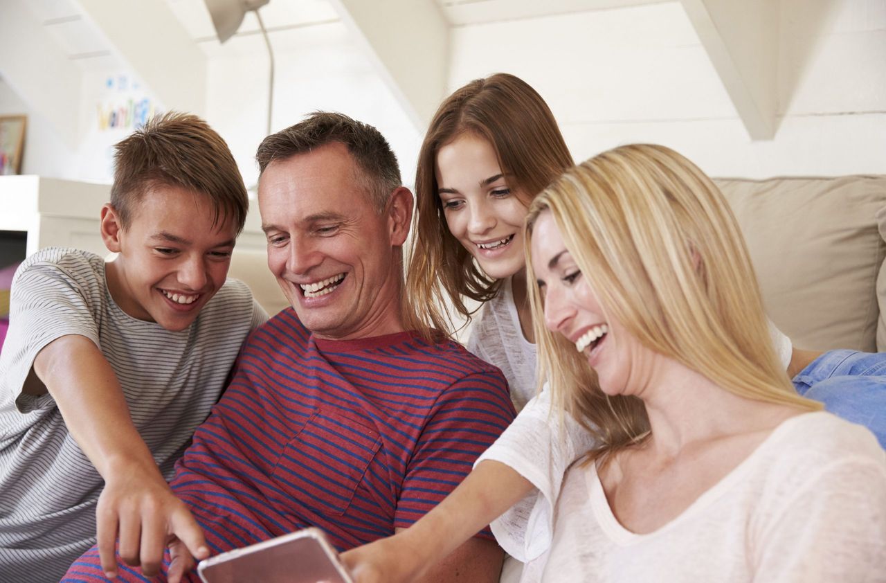 family looking at phone