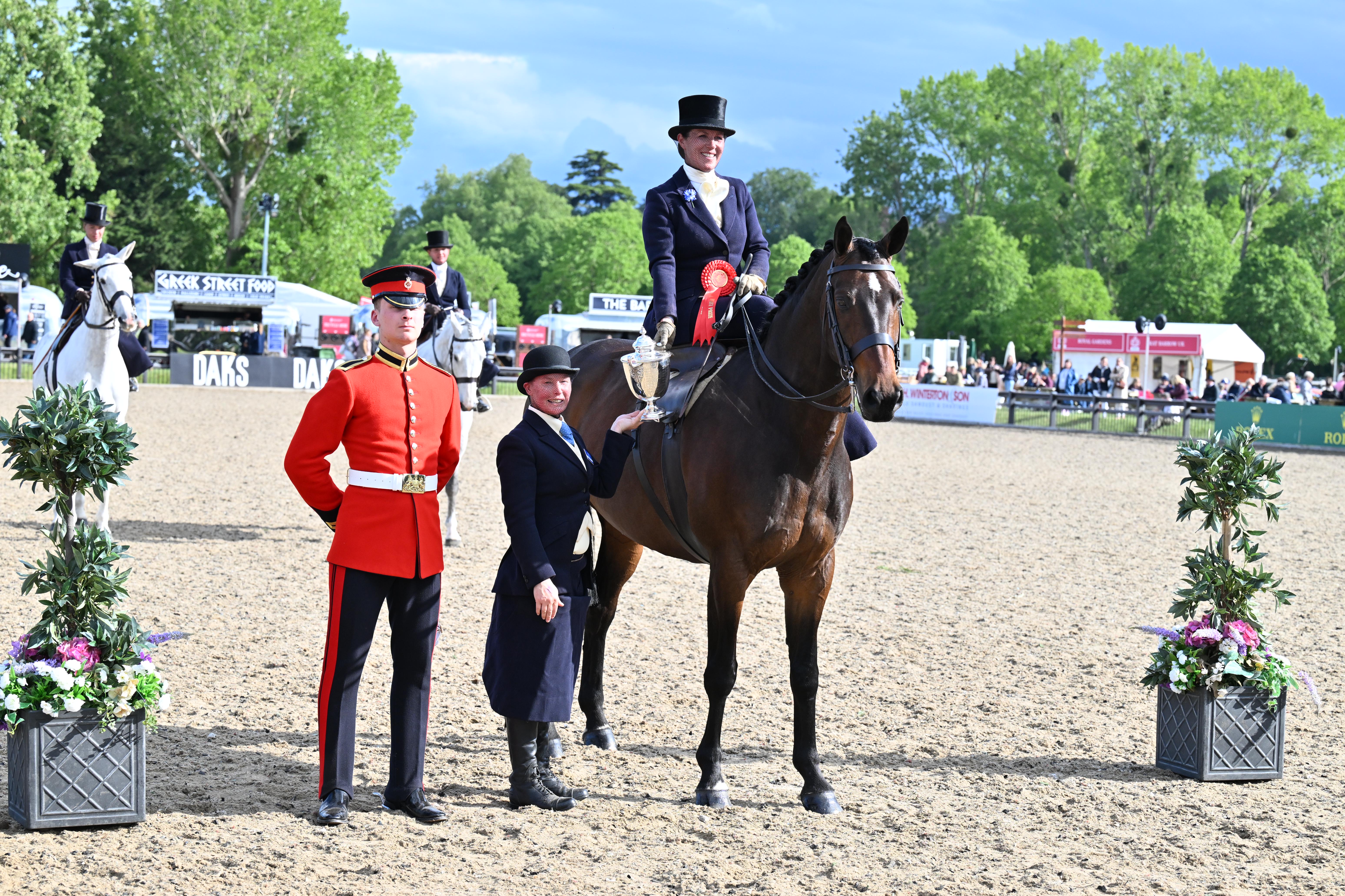 Charlotte Clark and Harbourmaster II stand for a photo after they claim 2026 Windsor ladies hunter title