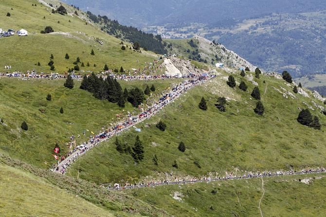 The peloton ascend during the 2010 Tour de France en route to Ax 3 Domaines