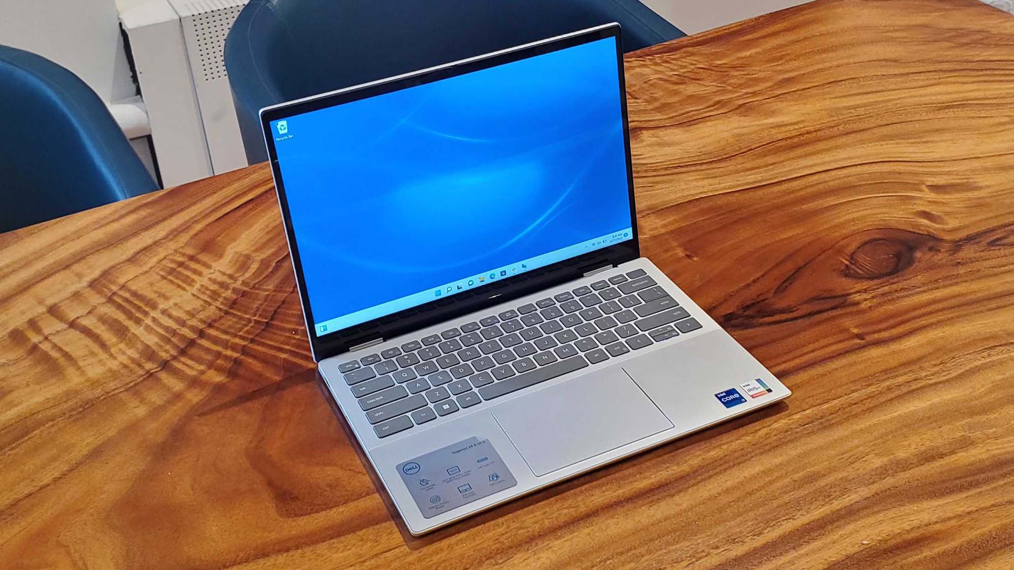 A Dell Inspiron 14 2 in 1 on a wooden table