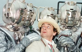 Sylvester McCoy as the Doctor seen here on location near Arundel with the Cybermen during the filming of the Dr Who story called The Silver Nemesis. 28th June 1988