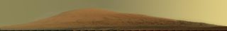 This mosaic of images from the Mast Camera (Mastcam) on NASA's Mars rover Curiosity shows Mount Sharp in raw color as recorded by the camera. Raw color shows the scene's colors as they would look in a typical smart-phone camera photo, before any adjustment. The component images were taken during the 45th Martian day, or sol, of Curiosity's mission on Mars (Sept. 20, 2012). Image released March 15, 2013.