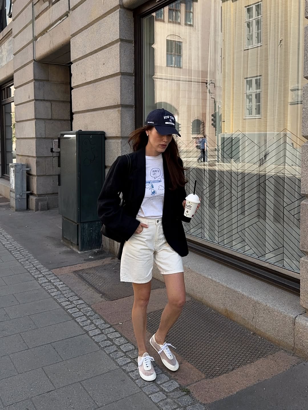 Annabel in mesh trainers, blazer and shorts