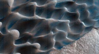 As the seasons change on Mars, triggering winds, dunes like these slowly move.