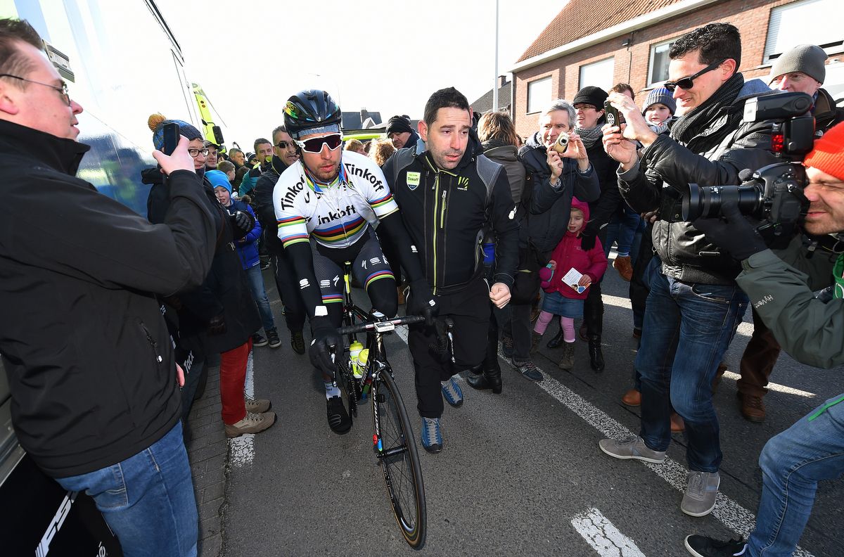 Peter Sagan escorted to the race start