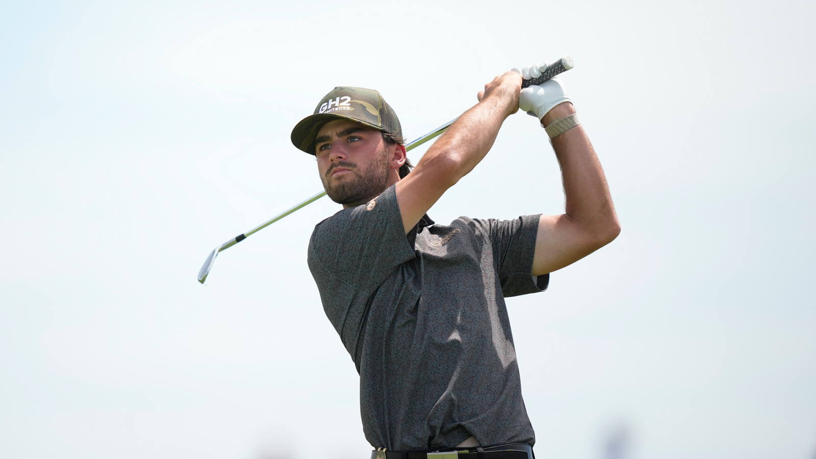 Ryder Cowan hits a wedge shot