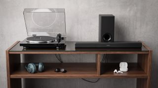 A selection of hi-fi and audio products arrange in a typical media room setting.