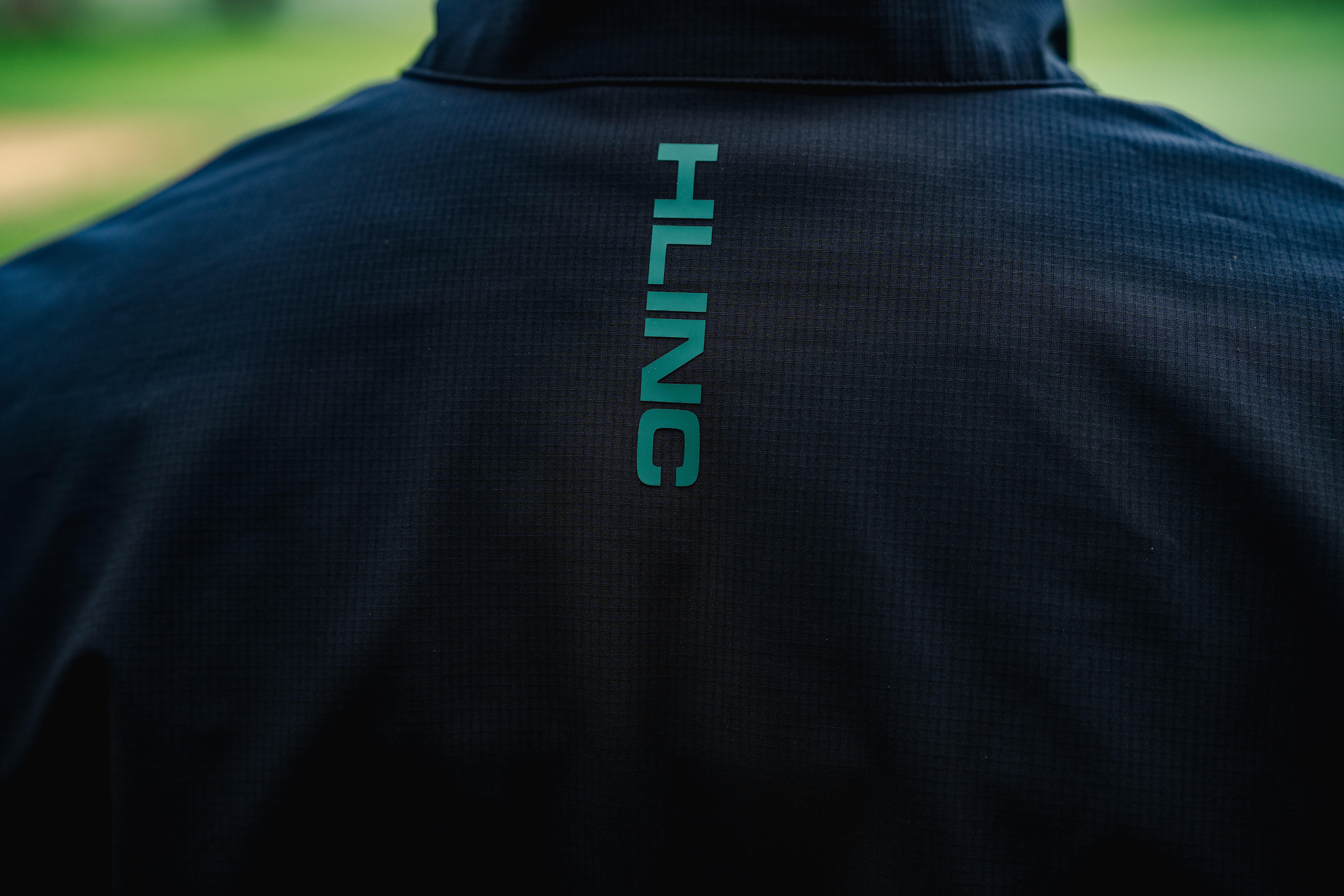 A close-up of the HLINC Full Zip Waterproof Links Golf Jacket