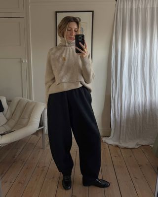 @brittanybathgate wearing trousers, jumper and black loafers