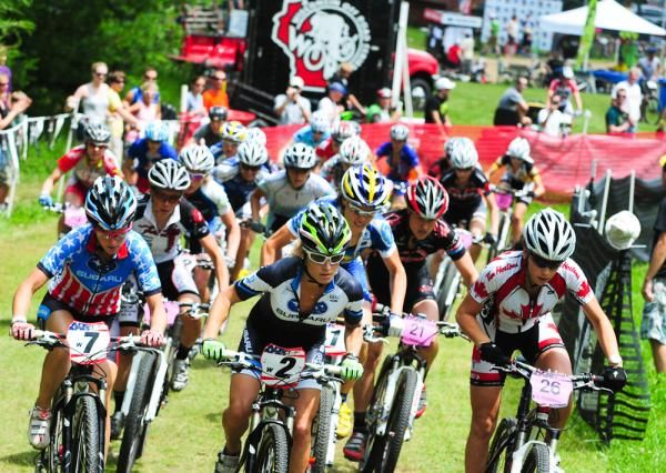 The elite women's start is led out by Willow Koerber (Subaru-Trek).