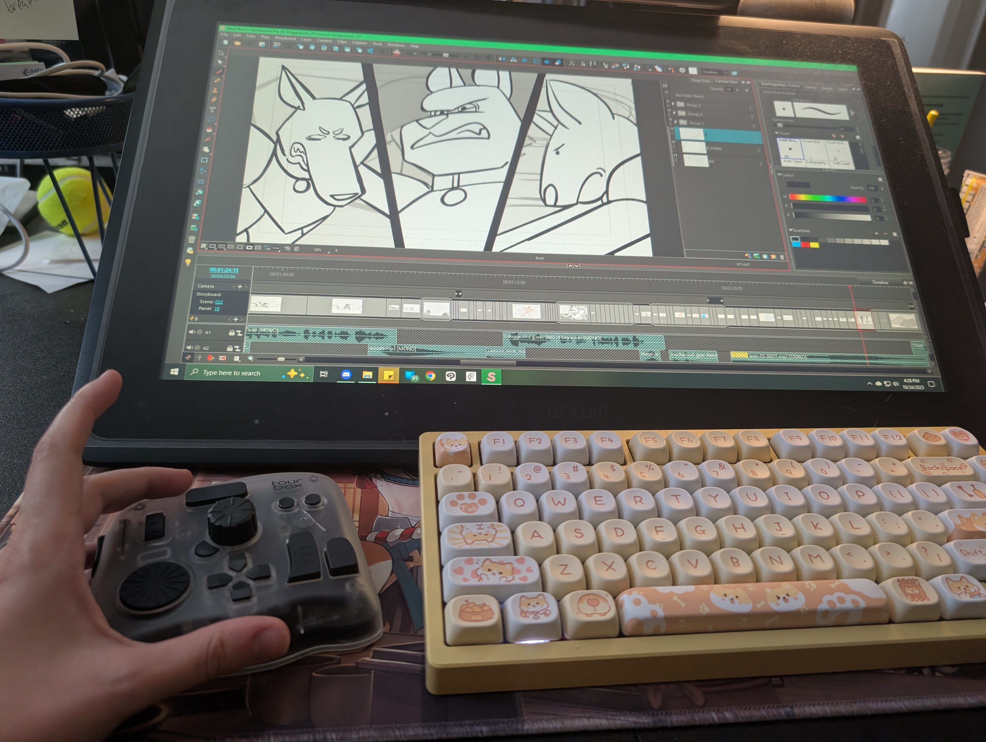 drawing tablets; an artist using a shortcut key device placed next to a drawing tablet and keyboard