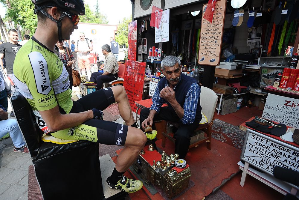 A riders takes a break for a shoeshine.