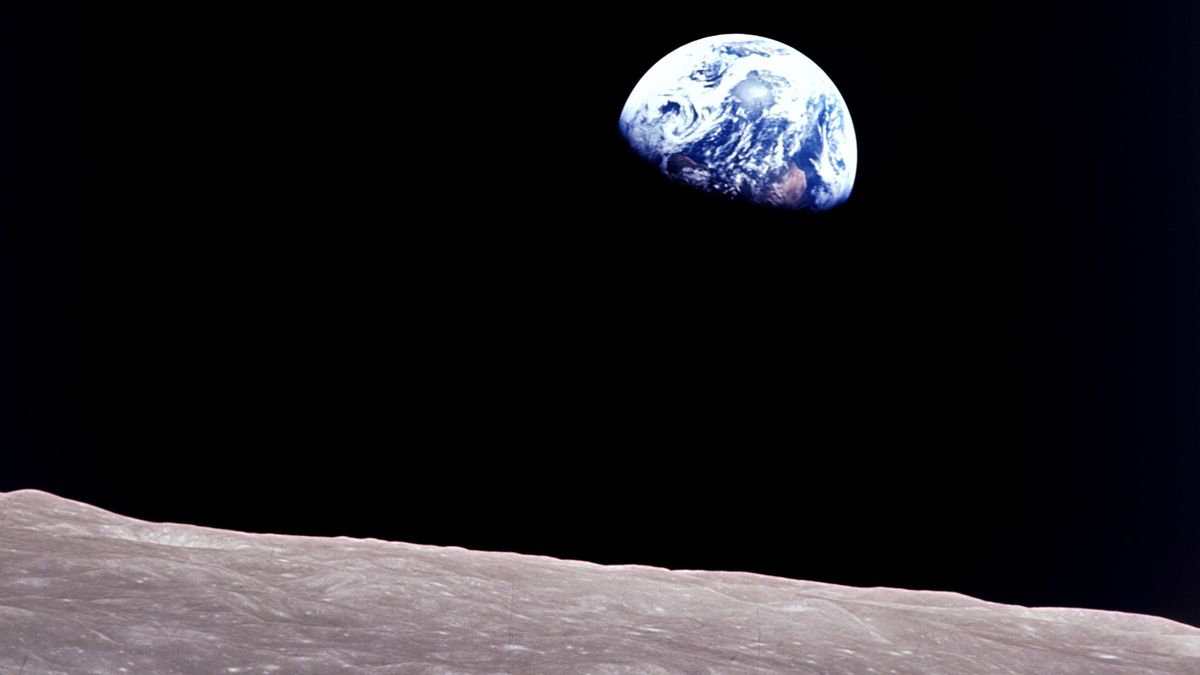 Taken aboard Apollo 8 by Bill Anders, this iconic picture shows Earth peeking out from beyond the lunar surface as the first crewed spacecraft circumnavigated the Moon, with astronauts Anders, Frank Borman, and Jim Lovell aboard.