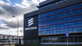 Ericsson office building set against a bright blue cloudy sky