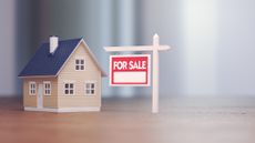 Real Estate Sign in Front of Model Home