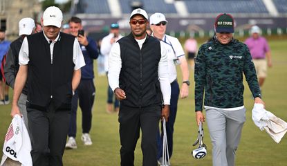 Tiger Woods and Justin Thomas walk down the fairway at St Andrews