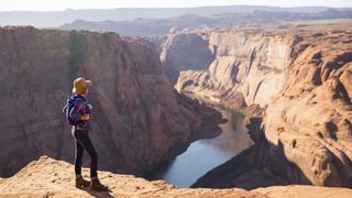 A woman hiker on horseshoe bend grand canyon