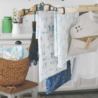 A laundry room with hung laundry