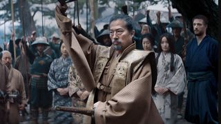 Hiroyuki Sanada's Lord Yoshii Toranaga holds up an item to an assembled crowd in Shogun, one of the best Hulu shows