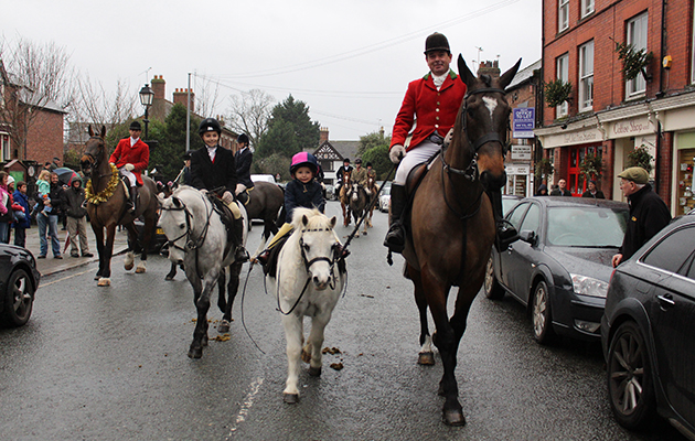 Robert Walker &amp;mdash; a well-known face on the showing circuit &amp;mdash; with his two-year-old daughter Izzy and son Sam riding up Tarporley High Street with the Cheshire Hunt