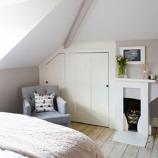 bedroom with wooden flooring and photoframe on wall